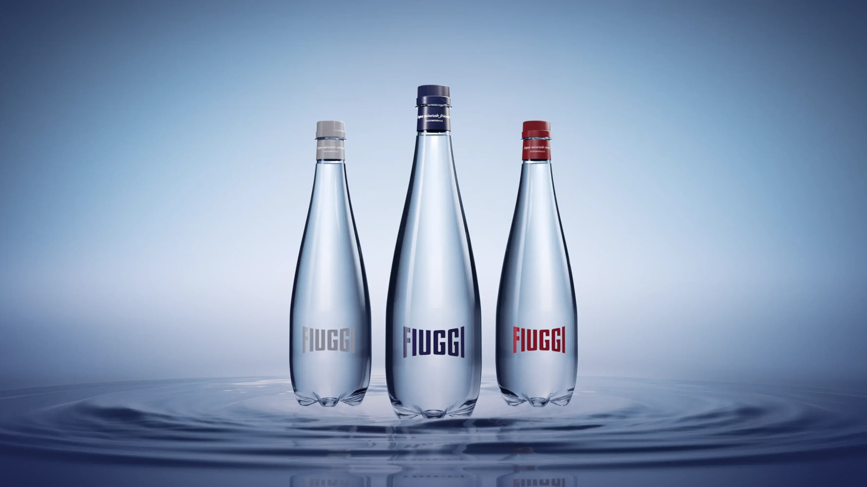 Acqua Fiuggi Premium: still, sparkling and vivace bottles on a light blue background